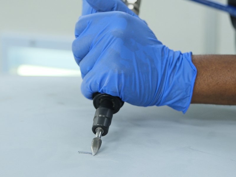 Close up of Hsutech straight die grinder head in use grinding metal